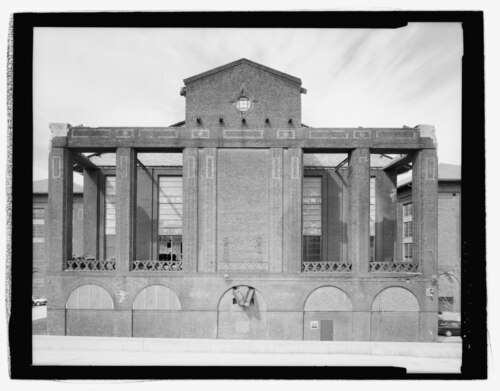 Power plant boiler house facade showing industrial water treatment equipment