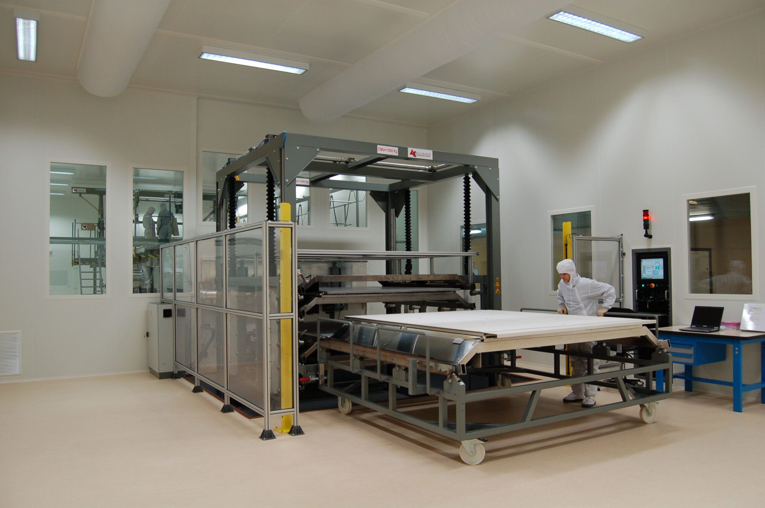 Optical coating machine PACA2M by CILAS under cleanroom conditions for precision lens manufacturing