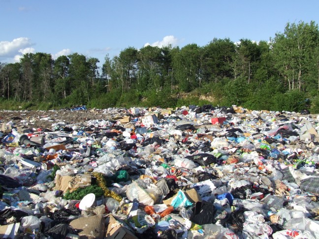 Municipal landfill site showing waste layers and leachate collection system