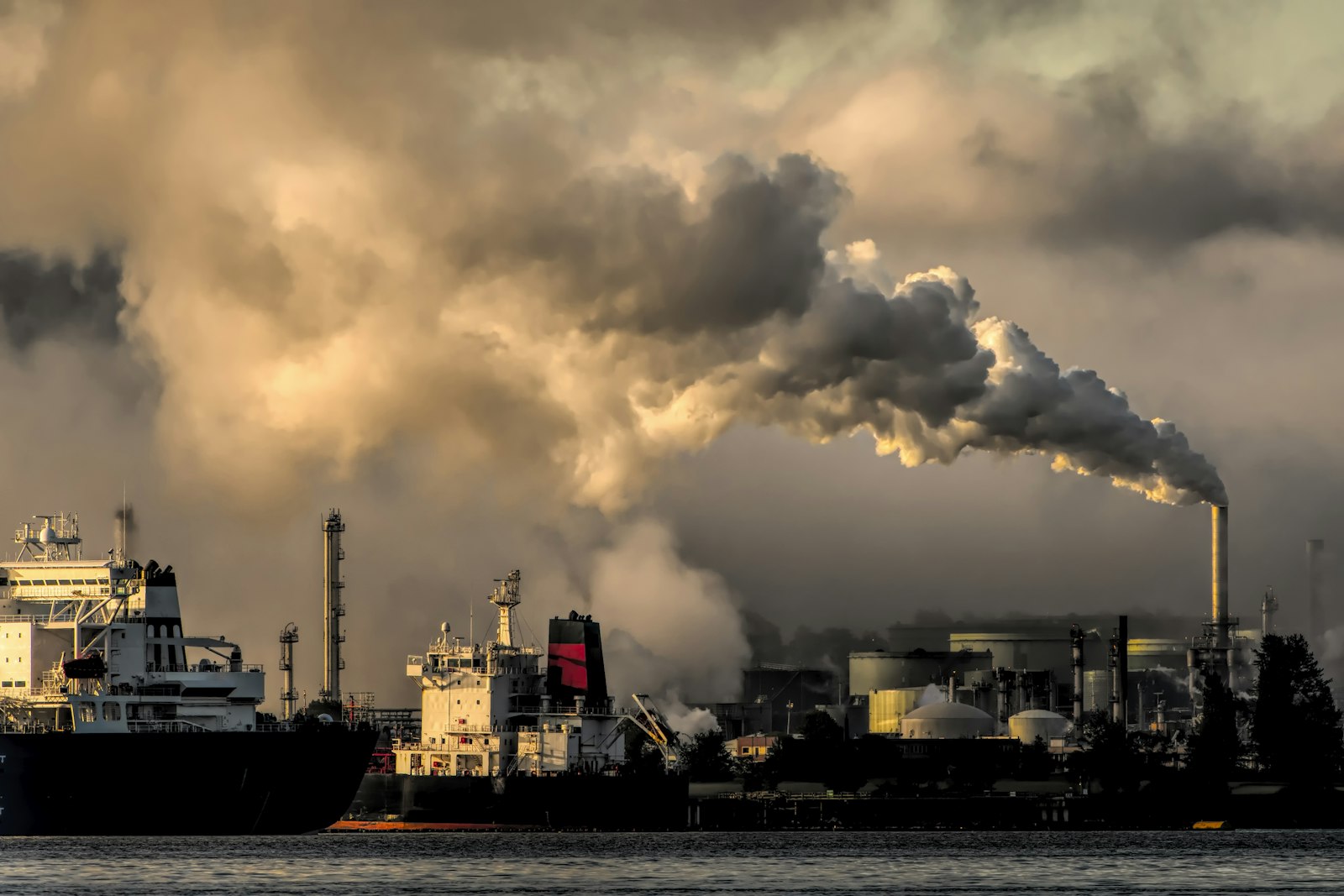 Industrial power plant with cooling towers and smokestacks
